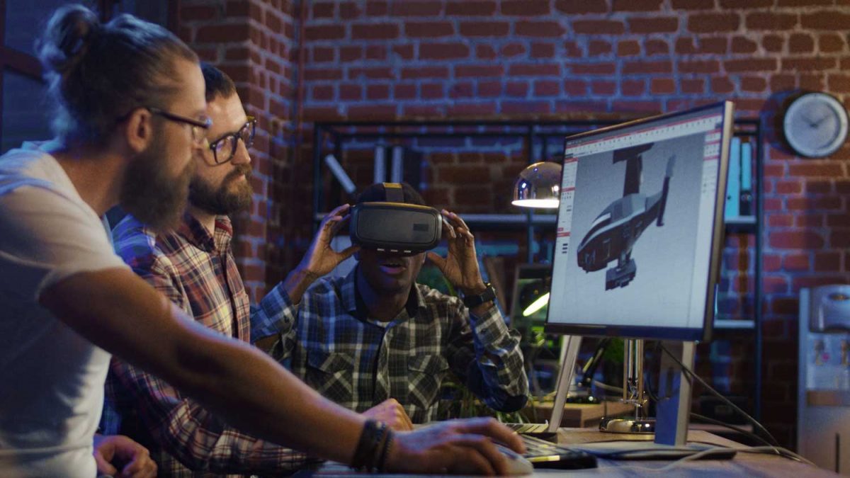 Web Developers in Orange County. The image shows people working together to build a website