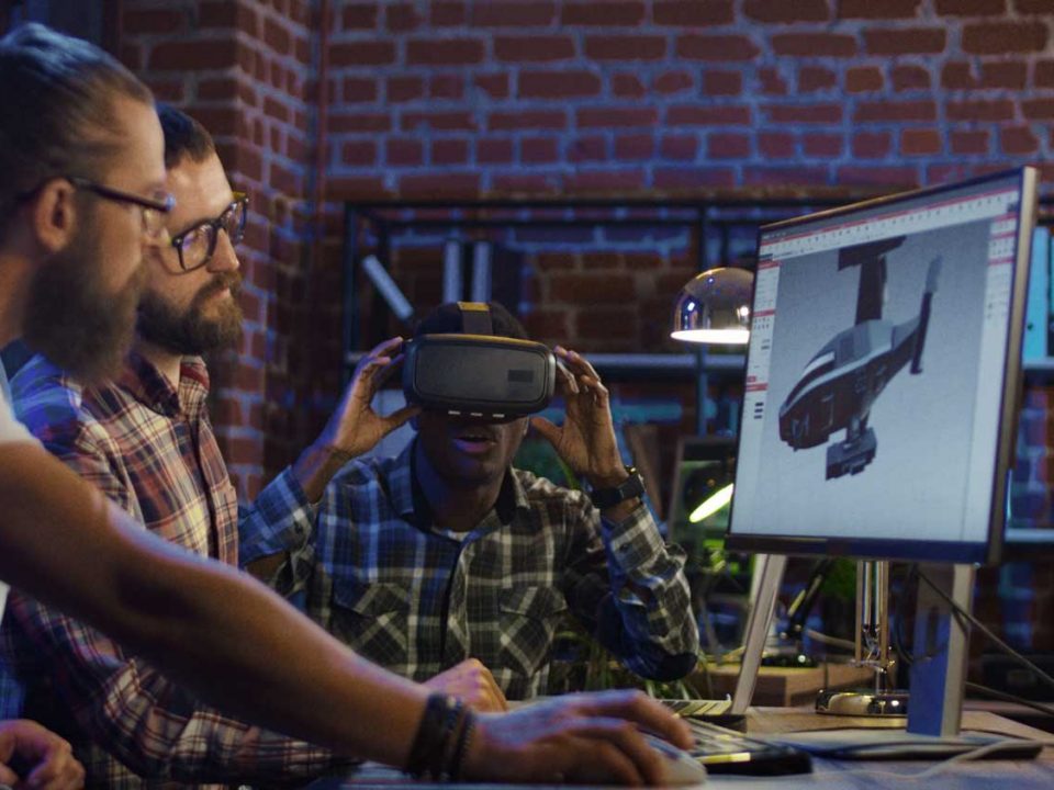 Web Developers in Orange County. The image shows people working together to build a website